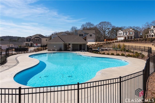 view of swimming pool with a patio