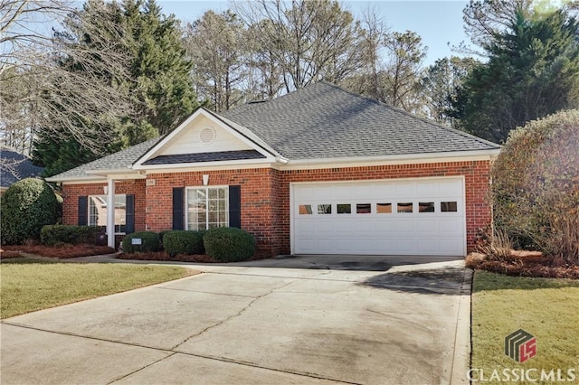 view of front of home featuring a garage and a front lawn