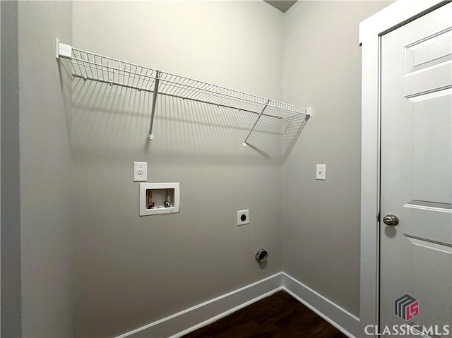 clothes washing area featuring hookup for a washing machine, dark wood-type flooring, and hookup for an electric dryer