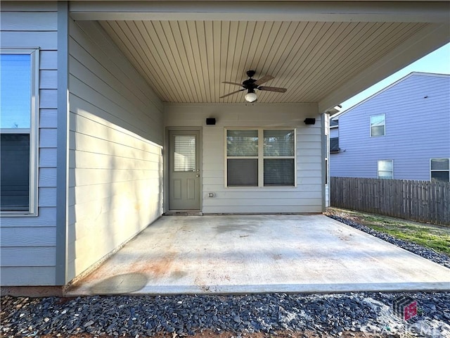 property entrance with a patio and ceiling fan