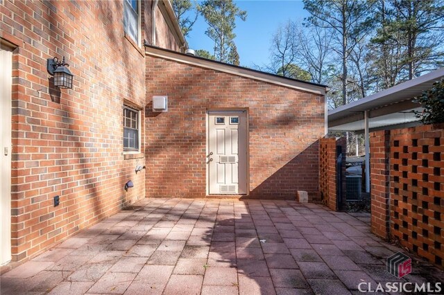 doorway to property with a patio