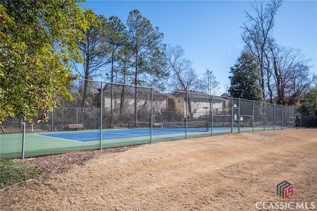 view of basketball court featuring tennis court