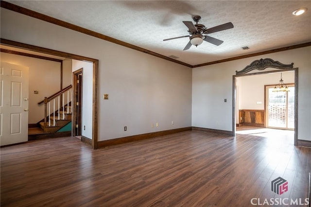 unfurnished room with crown molding, dark wood-type flooring, a textured ceiling, and ceiling fan with notable chandelier