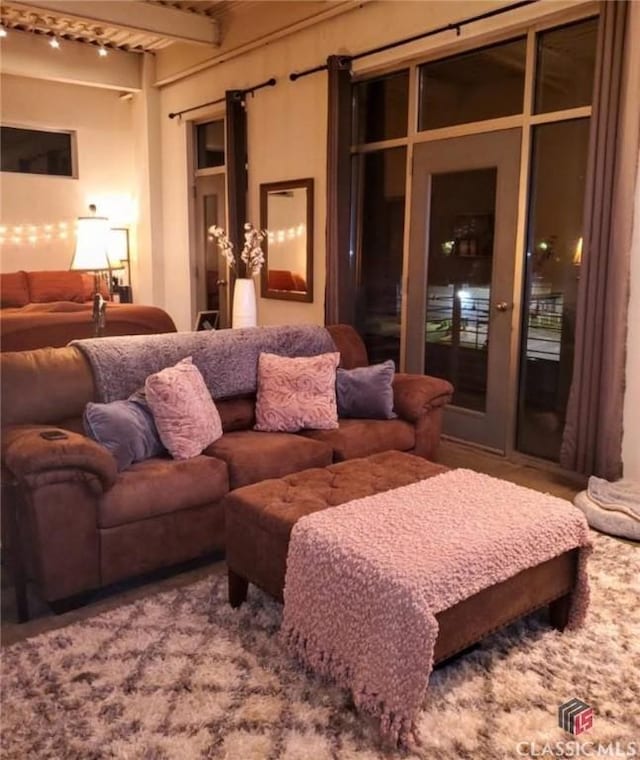 living room featuring beam ceiling