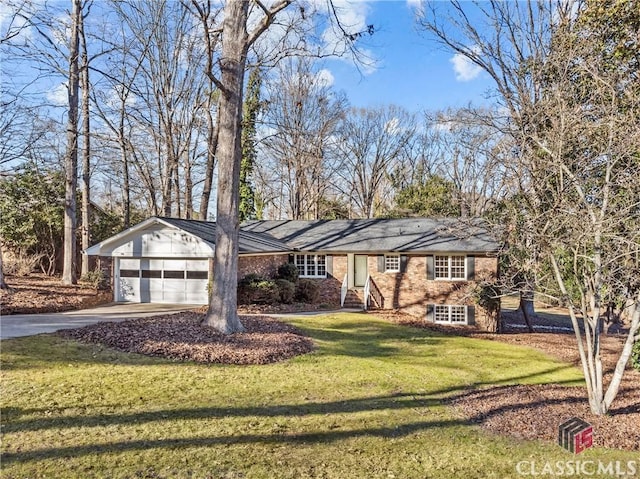 ranch-style home with a garage and a front yard