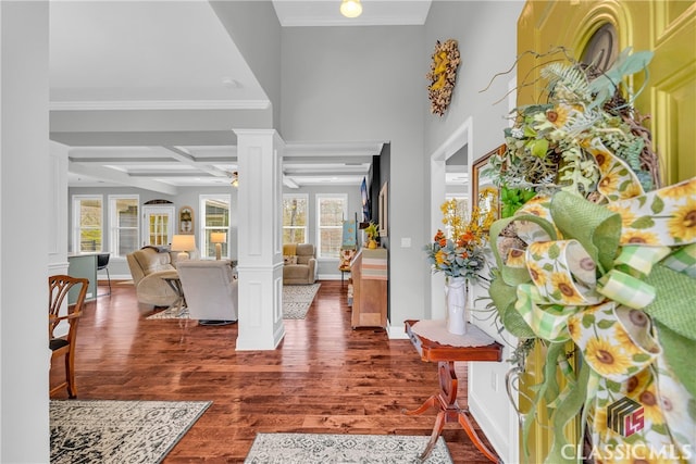 foyer entrance featuring coffered ceiling, ornamental molding, dark hardwood / wood-style flooring, beamed ceiling, and decorative columns