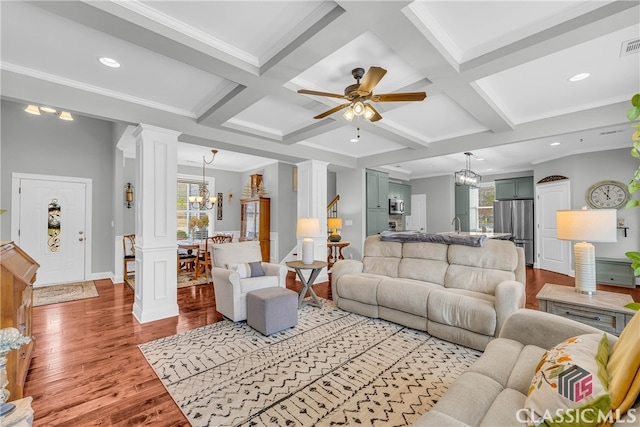 living room with coffered ceiling, plenty of natural light, light hardwood / wood-style flooring, and ornate columns