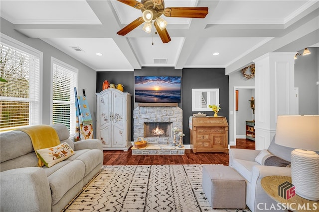 living room with coffered ceiling, ornate columns, wood-type flooring, beamed ceiling, and a fireplace