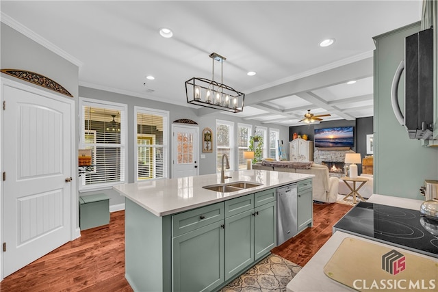 kitchen with pendant lighting, sink, coffered ceiling, stainless steel appliances, and a center island with sink