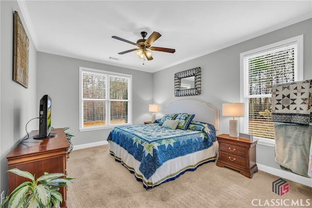 carpeted bedroom featuring multiple windows, crown molding, and ceiling fan