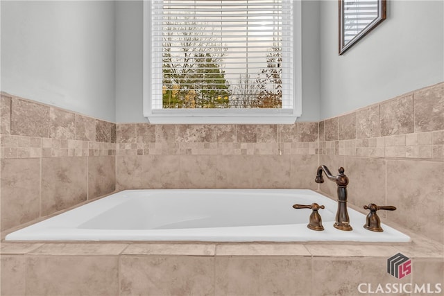 bathroom featuring a relaxing tiled tub