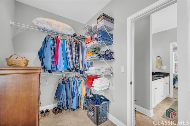 walk in closet featuring sink