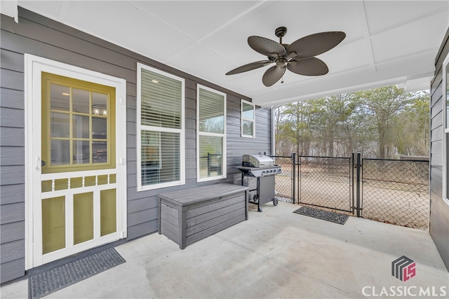 view of patio with grilling area and ceiling fan