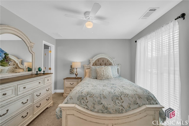 bedroom featuring light carpet and ceiling fan