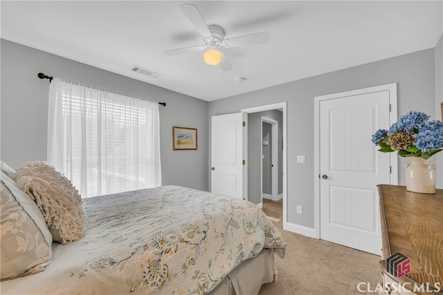 bedroom with light colored carpet and ceiling fan