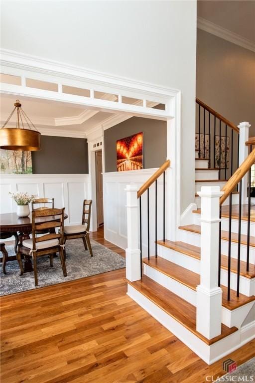 interior space featuring ornamental molding and hardwood / wood-style floors