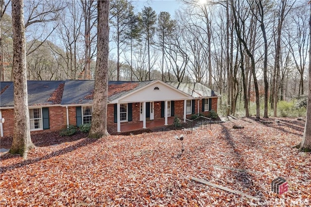 single story home with covered porch