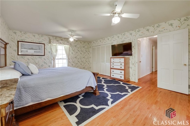 bedroom featuring hardwood / wood-style flooring and ceiling fan