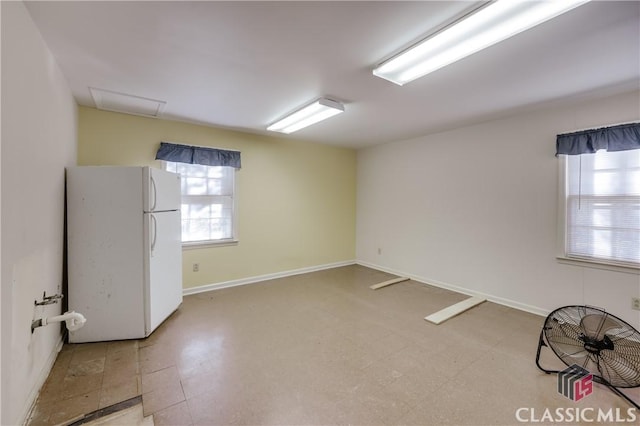 spare room featuring plenty of natural light