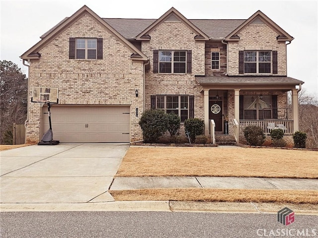 view of front of house featuring a garage and covered porch