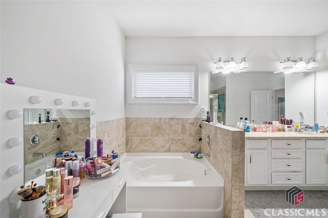 bathroom featuring vanity and shower with separate bathtub