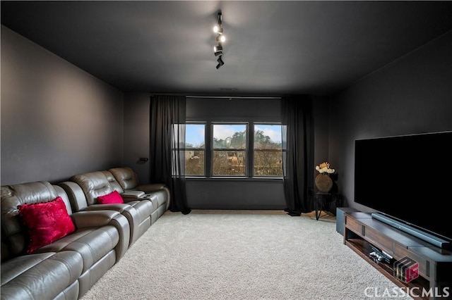 living room with track lighting and carpet flooring