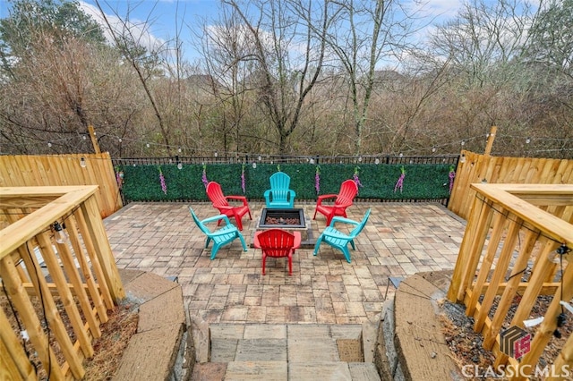 view of patio / terrace with an outdoor fire pit