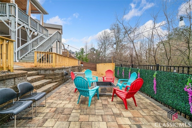 view of patio featuring an outdoor fire pit