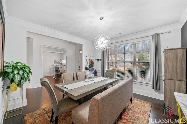 dining room with crown molding, dark hardwood / wood-style floors, and a notable chandelier