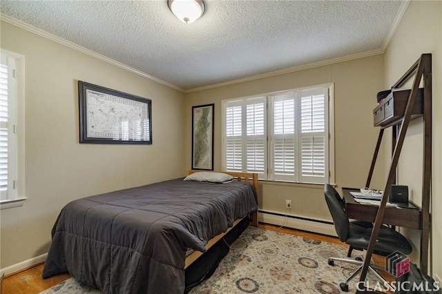 bedroom with ornamental molding, light wood-type flooring, a textured ceiling, and a baseboard heating unit