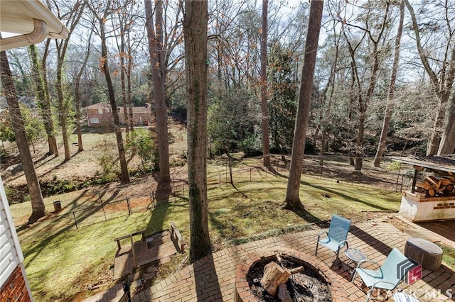 exterior space featuring an outdoor fire pit