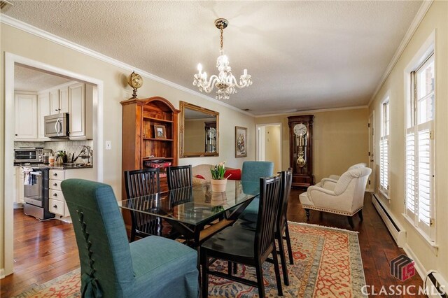 dining space featuring dark hardwood / wood-style floors, a healthy amount of sunlight, and baseboard heating