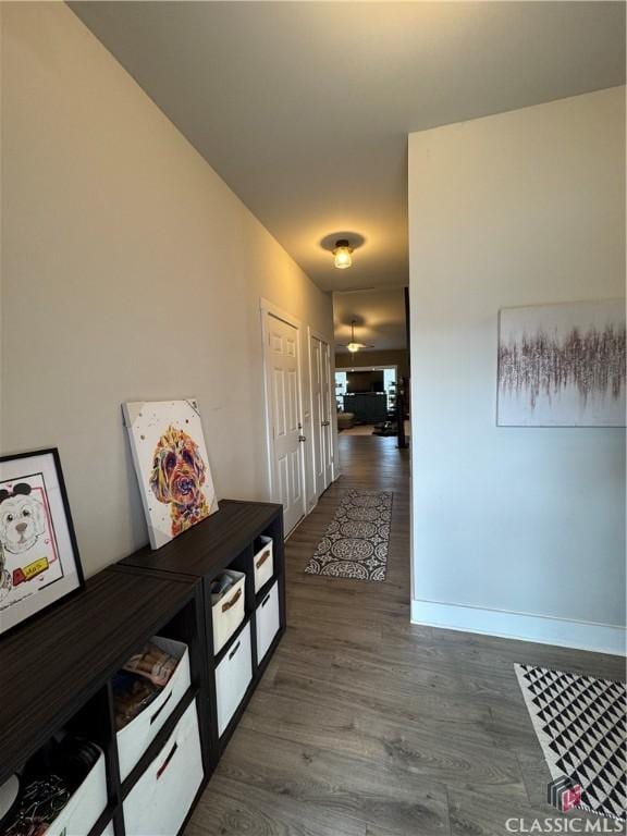 corridor featuring dark wood-type flooring