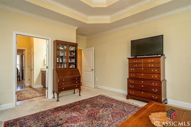 sitting room with crown molding, light colored carpet, and a raised ceiling