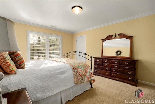 carpeted bedroom featuring crown molding