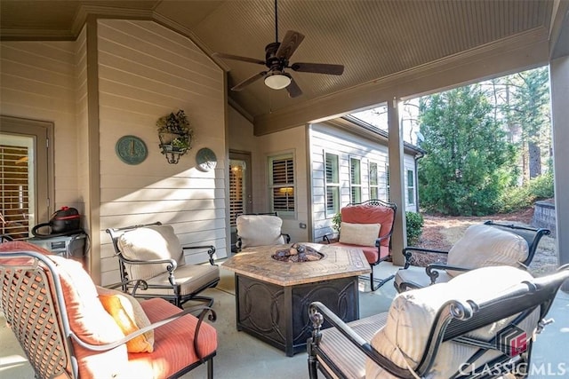 view of patio with an outdoor living space with a fire pit and ceiling fan