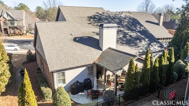 rear view of property featuring a patio