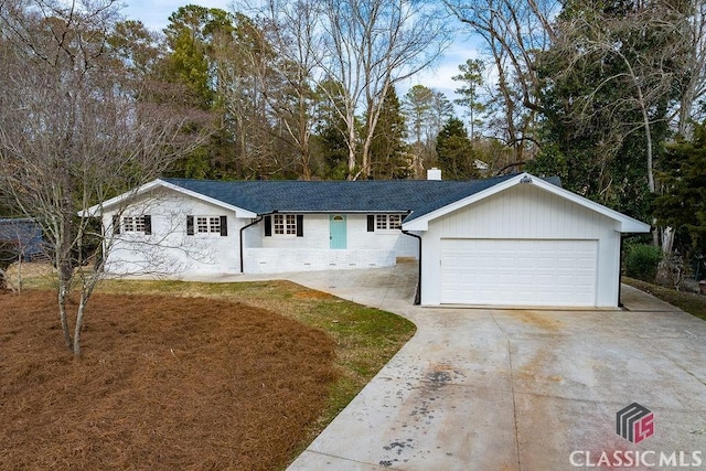 ranch-style house featuring a garage