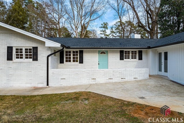 doorway to property with a patio area