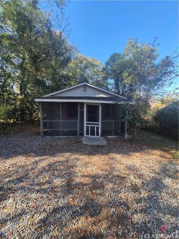 view of front of house featuring a sunroom