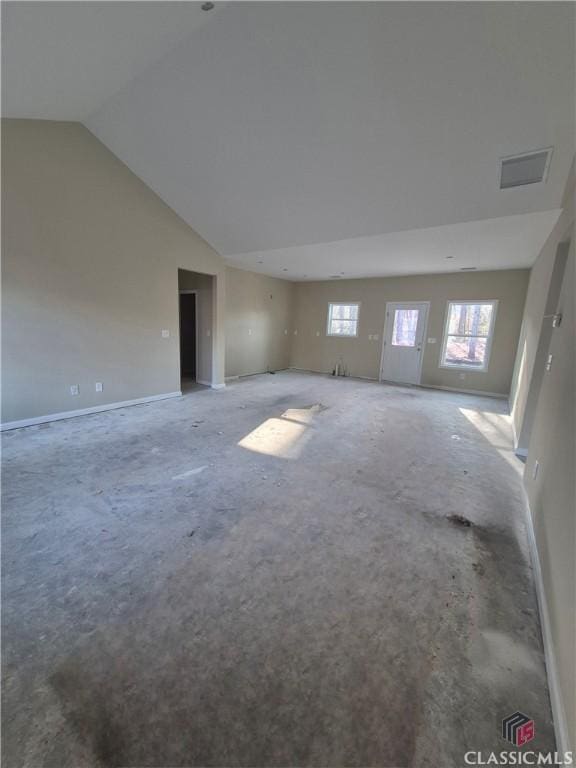 empty room featuring lofted ceiling