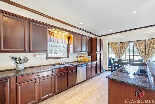 kitchen featuring a wealth of natural light, sink, dark stone countertops, stainless steel dishwasher, and black electric cooktop