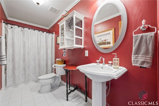 bathroom featuring ornamental molding, toilet, and tile patterned flooring