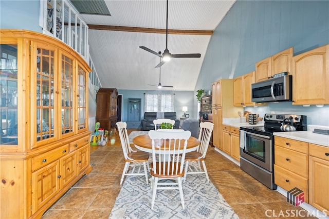 kitchen featuring ceiling fan, appliances with stainless steel finishes, high vaulted ceiling, and light brown cabinetry