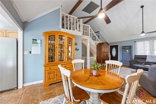 dining room with light tile patterned flooring, ceiling fan, high vaulted ceiling, and beamed ceiling