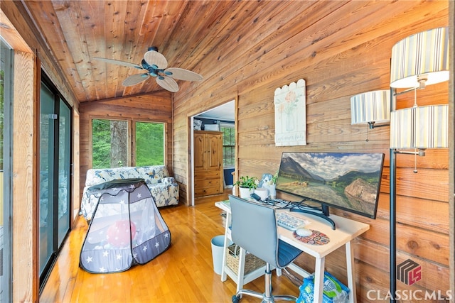 bedroom with wood ceiling, wood walls, vaulted ceiling, and hardwood / wood-style flooring