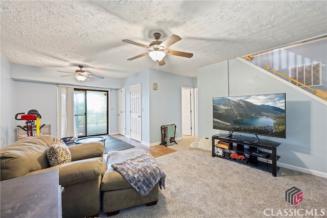 carpeted living room with a textured ceiling and ceiling fan