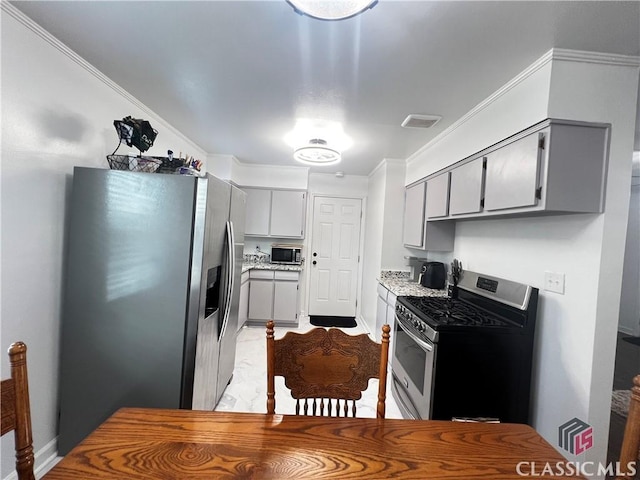 kitchen featuring stainless steel appliances, ornamental molding, and gray cabinets