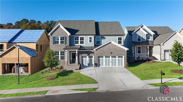 view of front facade with a garage and a front lawn