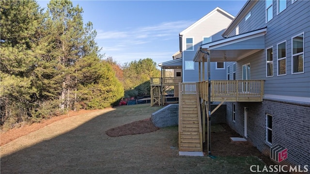 view of yard with a wooden deck